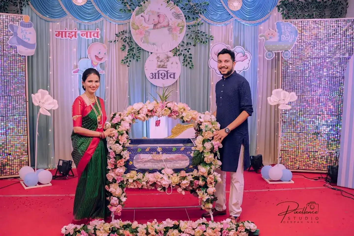 Baby cradle decorated with flowers for a Hindu naming ceremony (naam karan)